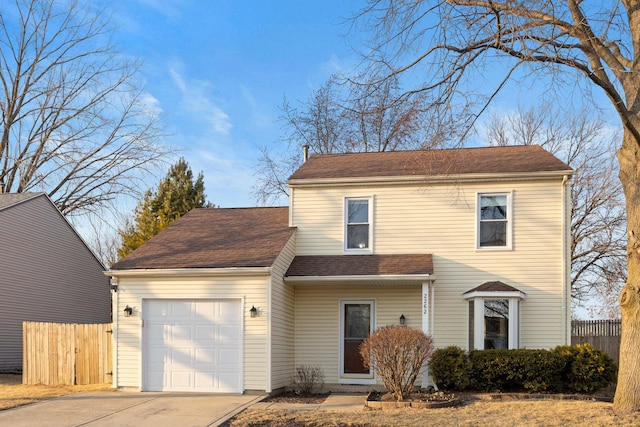 traditional-style house featuring a garage, fence, concrete driveway, and roof with shingles