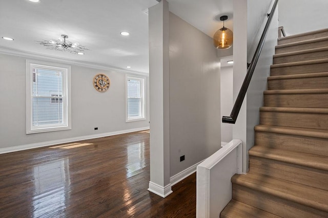 stairway featuring ornamental molding, recessed lighting, baseboards, and wood finished floors