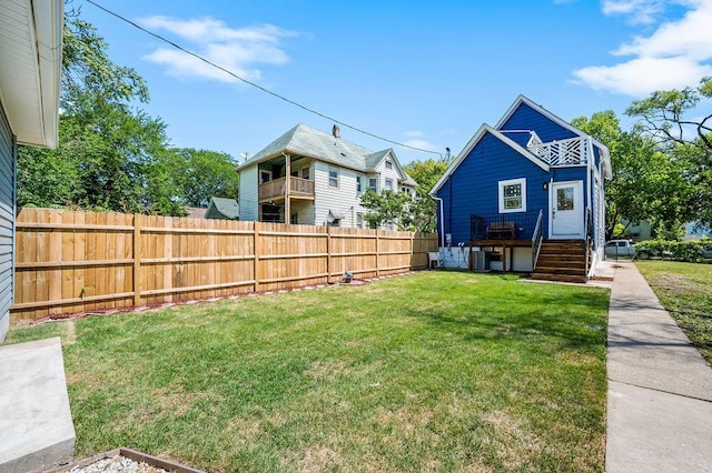 view of yard featuring central AC unit and fence