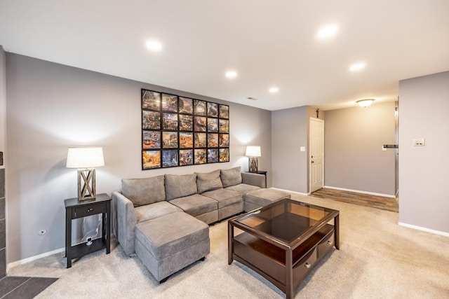 living room featuring recessed lighting, light carpet, visible vents, and baseboards