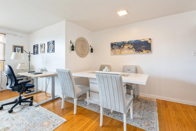 office featuring baseboards and hardwood / wood-style floors