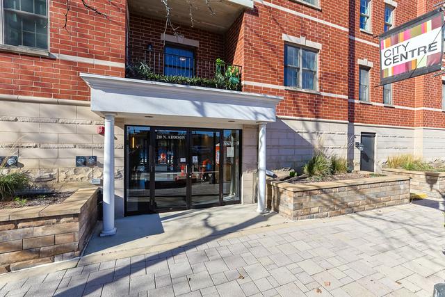 entrance to property with brick siding and french doors