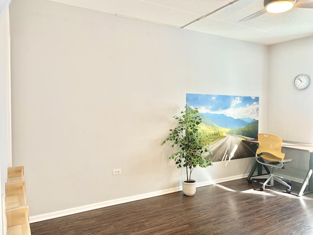 home office featuring a ceiling fan, wood finished floors, and baseboards