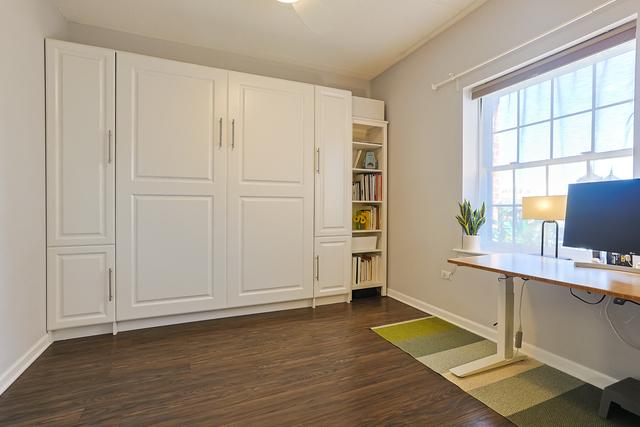 office area featuring dark wood-style floors and baseboards