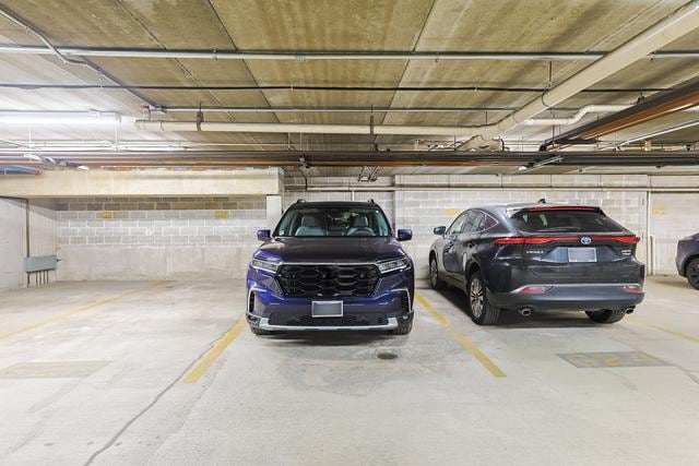 parking deck featuring concrete block wall