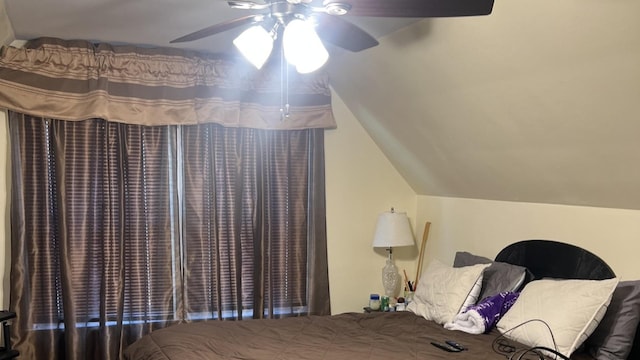 bedroom with ceiling fan and vaulted ceiling