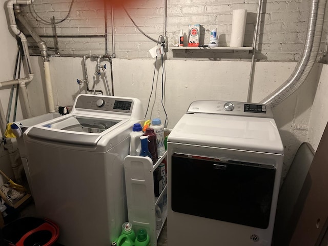 clothes washing area with laundry area and washer and dryer