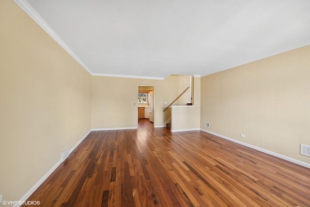 unfurnished living room featuring crown molding, visible vents, stairway, wood finished floors, and baseboards