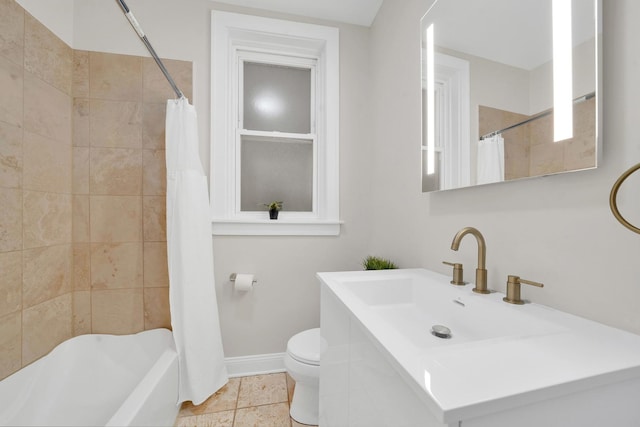 full bathroom featuring toilet, shower / bath combo, tile patterned flooring, baseboards, and vanity