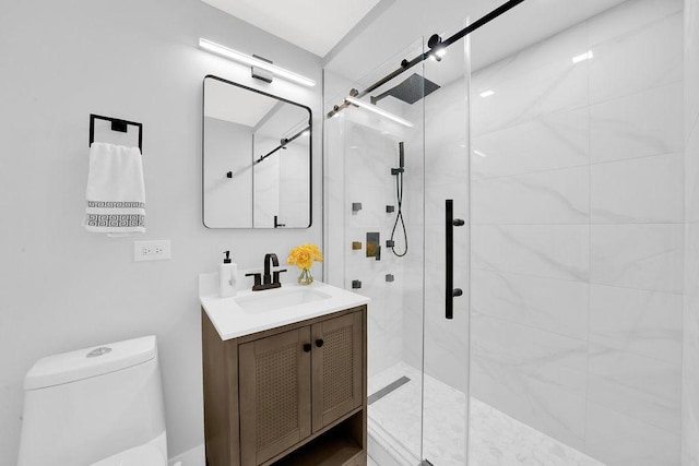 full bath featuring vanity, toilet, and a shower stall