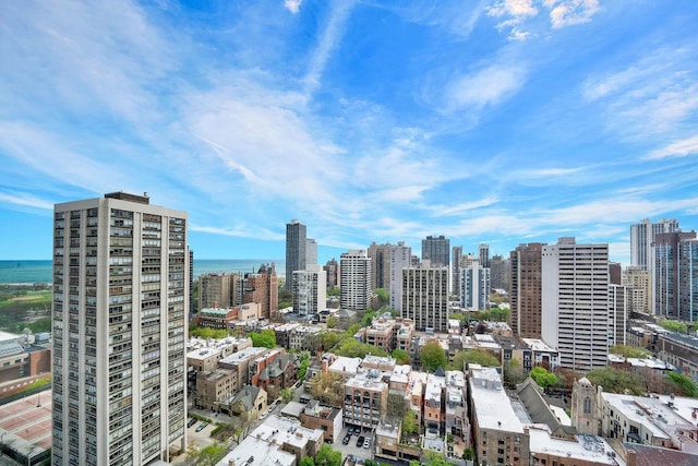 property's view of city featuring a water view