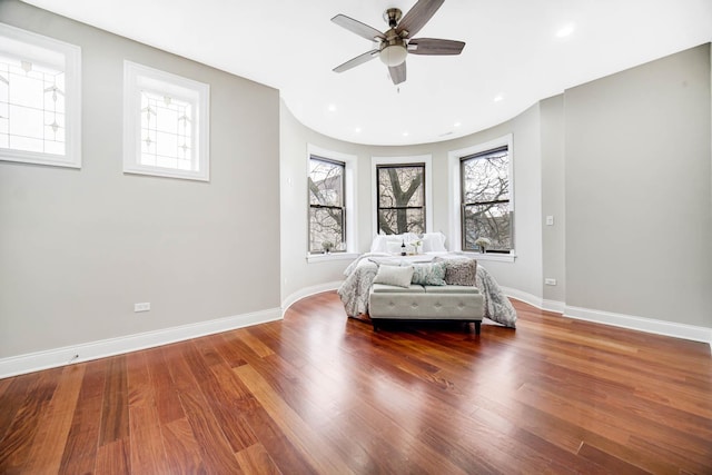 unfurnished bedroom featuring recessed lighting, a ceiling fan, baseboards, and wood finished floors