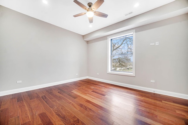 empty room featuring visible vents, baseboards, recessed lighting, wood finished floors, and a ceiling fan