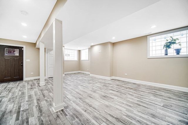 basement with recessed lighting, baseboards, and light wood finished floors