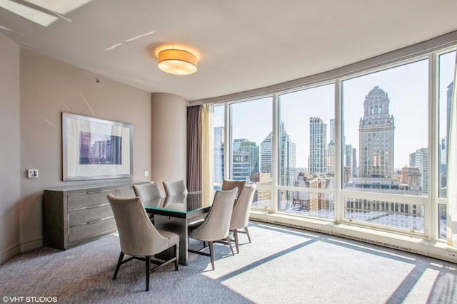 dining space with a view of city and carpet