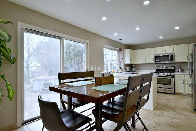 dining room featuring recessed lighting and light tile patterned flooring