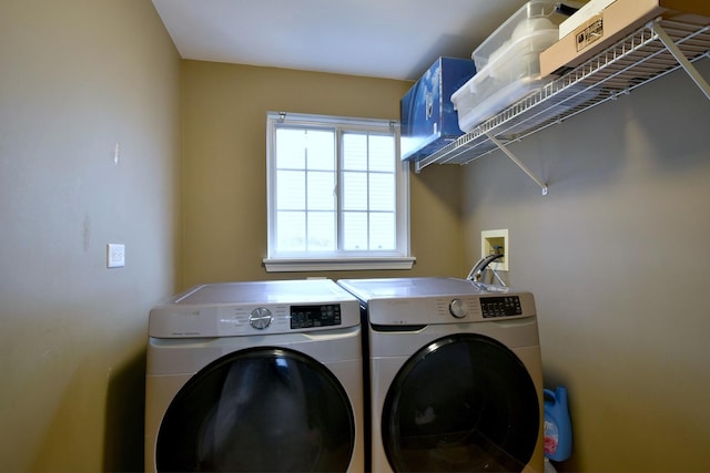 laundry room featuring laundry area and washer and clothes dryer