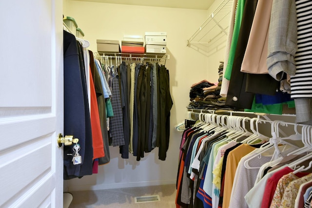 spacious closet featuring visible vents