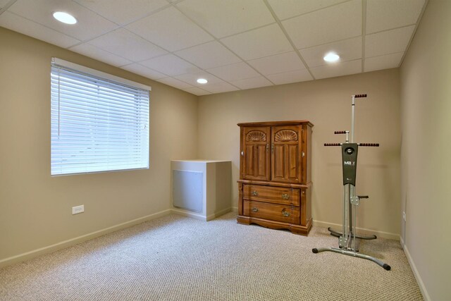 workout room featuring recessed lighting, carpet, a paneled ceiling, and baseboards