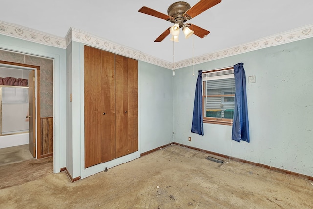 unfurnished room with visible vents, a ceiling fan, and baseboards