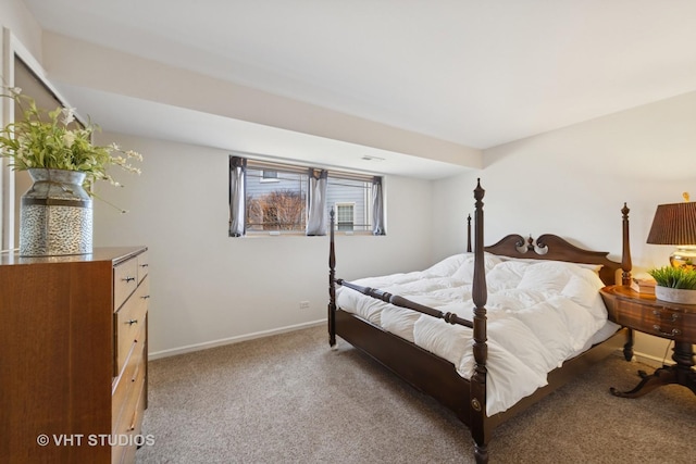 bedroom featuring baseboards and light carpet