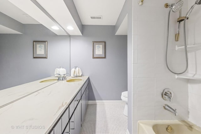 bathroom featuring tile patterned floors, toilet, baseboards, bathing tub / shower combination, and vanity