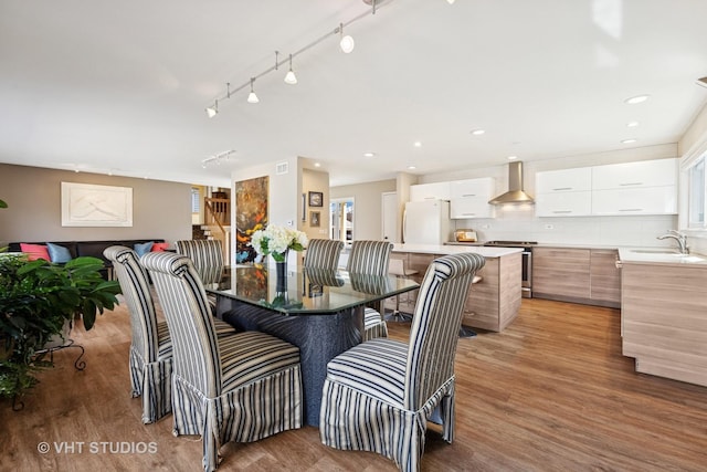 dining area featuring recessed lighting and light wood-style floors