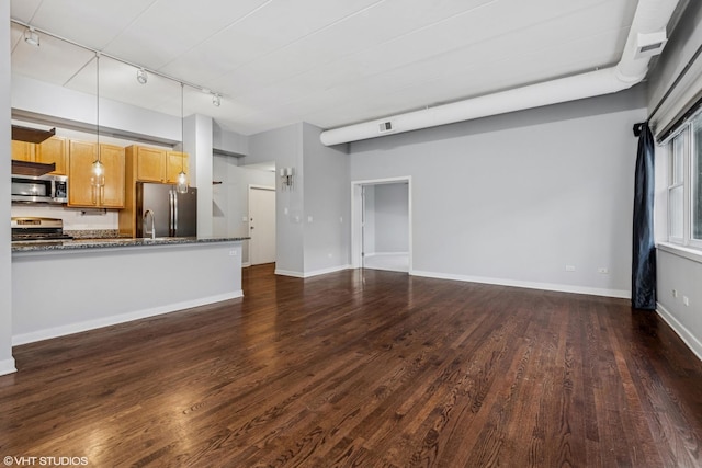 unfurnished living room with dark wood-style floors, visible vents, and baseboards