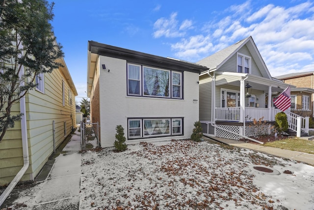 view of front of property with a porch and brick siding