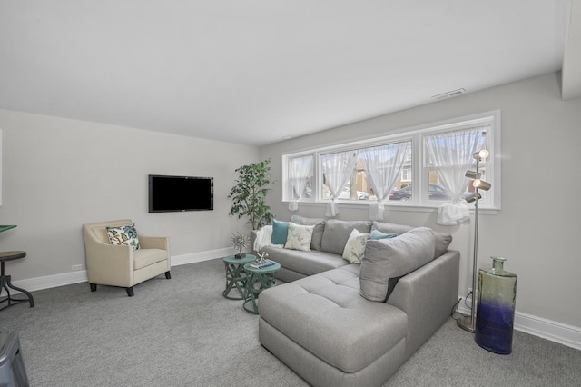 carpeted living room featuring visible vents and baseboards