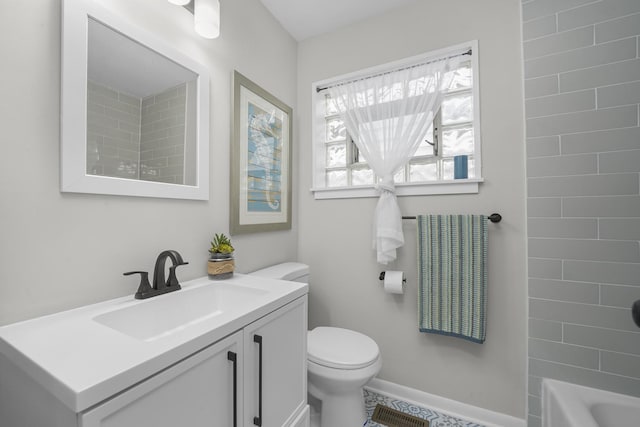 bathroom featuring visible vents, shower / bathing tub combination, toilet, vanity, and baseboards