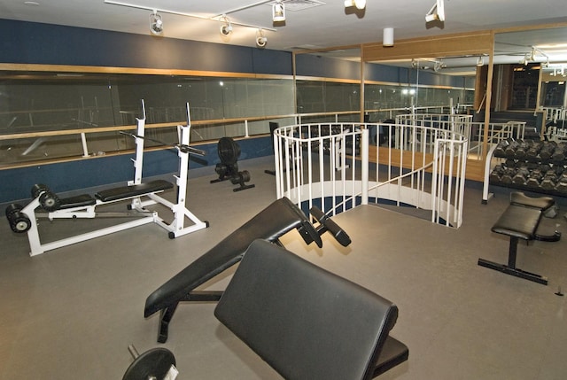 workout area featuring track lighting