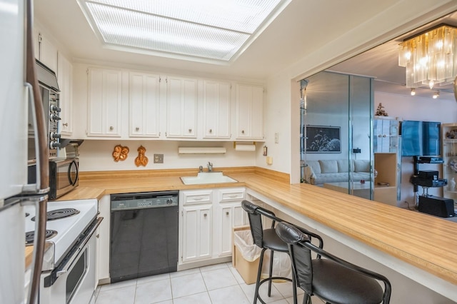 kitchen featuring white range with electric cooktop, black dishwasher, light tile patterned floors, refrigerator, and a sink