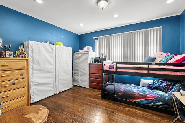 bedroom featuring recessed lighting and wood finished floors