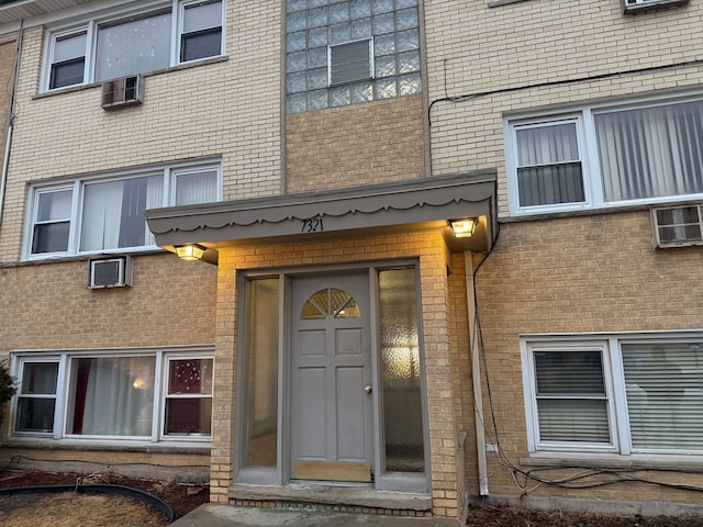 property entrance with brick siding