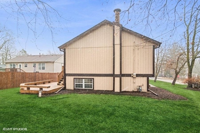 exterior space with fence and a yard