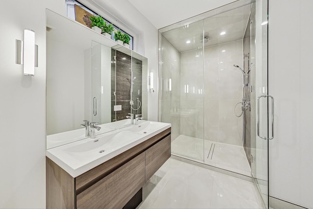 bathroom featuring a sink, double vanity, and a shower stall