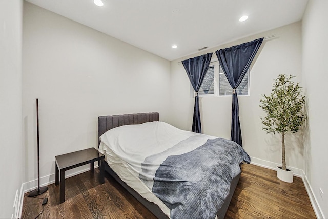 bedroom featuring recessed lighting, visible vents, and wood finished floors