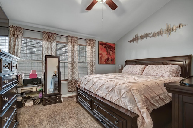 bedroom featuring light carpet, multiple windows, baseboards, and vaulted ceiling