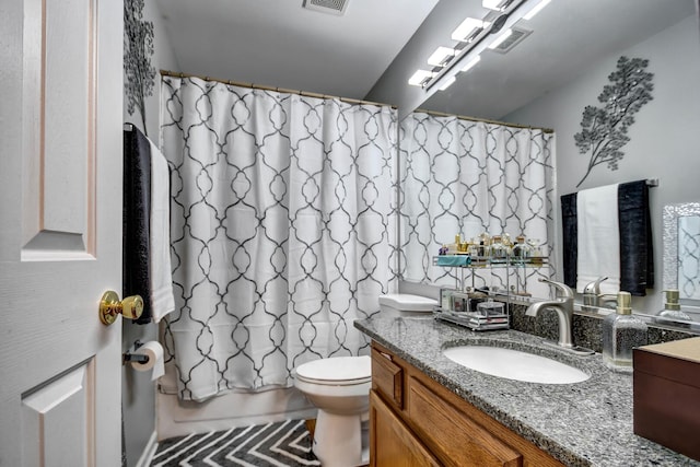 full bathroom with toilet, visible vents, and vanity