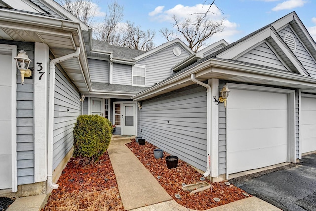 view of exterior entry featuring a garage