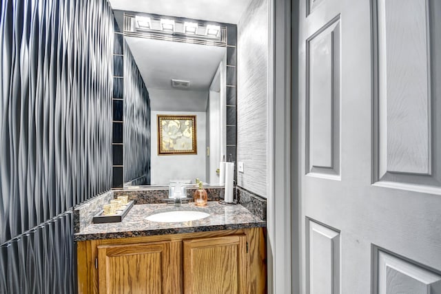 bathroom featuring vanity and visible vents