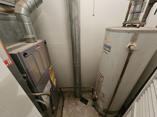 utility room featuring gas water heater