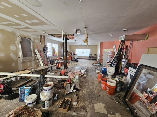 miscellaneous room with visible vents and hardwood / wood-style floors