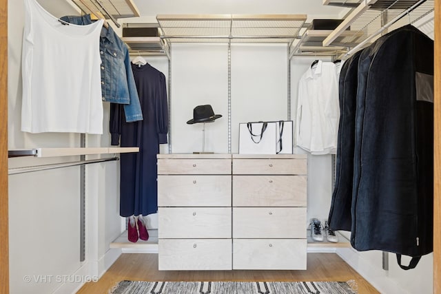 spacious closet with wood finished floors