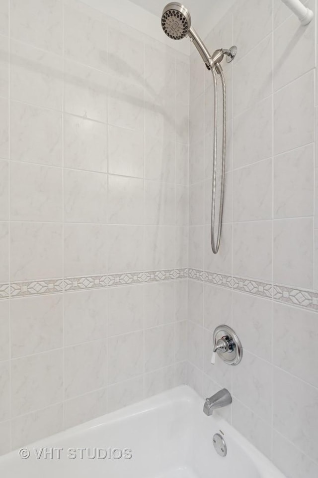 bathroom featuring  shower combination