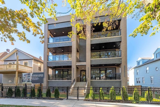 view of property featuring a fenced front yard