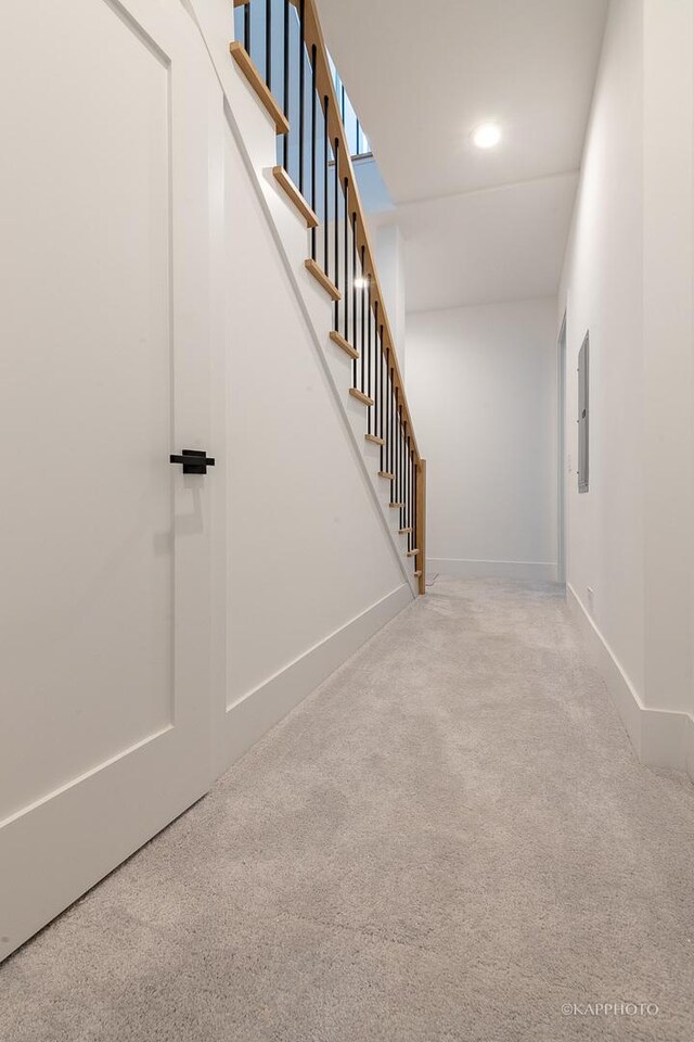 interior space with carpet flooring, stairway, and baseboards