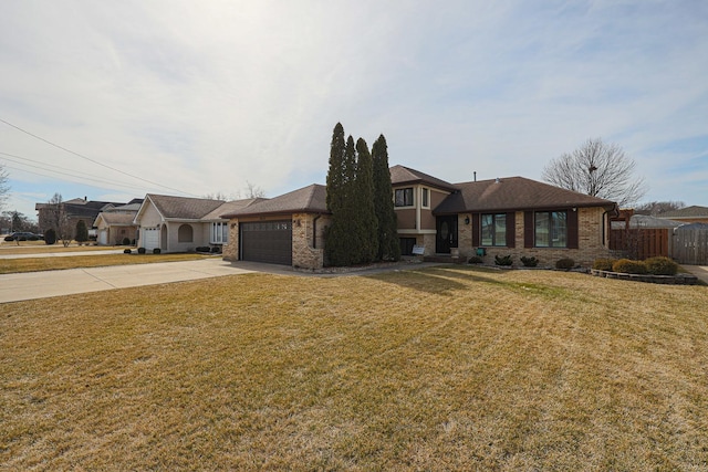 view of front of property featuring fence, concrete driveway, a front yard, a garage, and brick siding