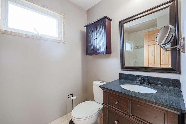 bathroom with toilet and vanity